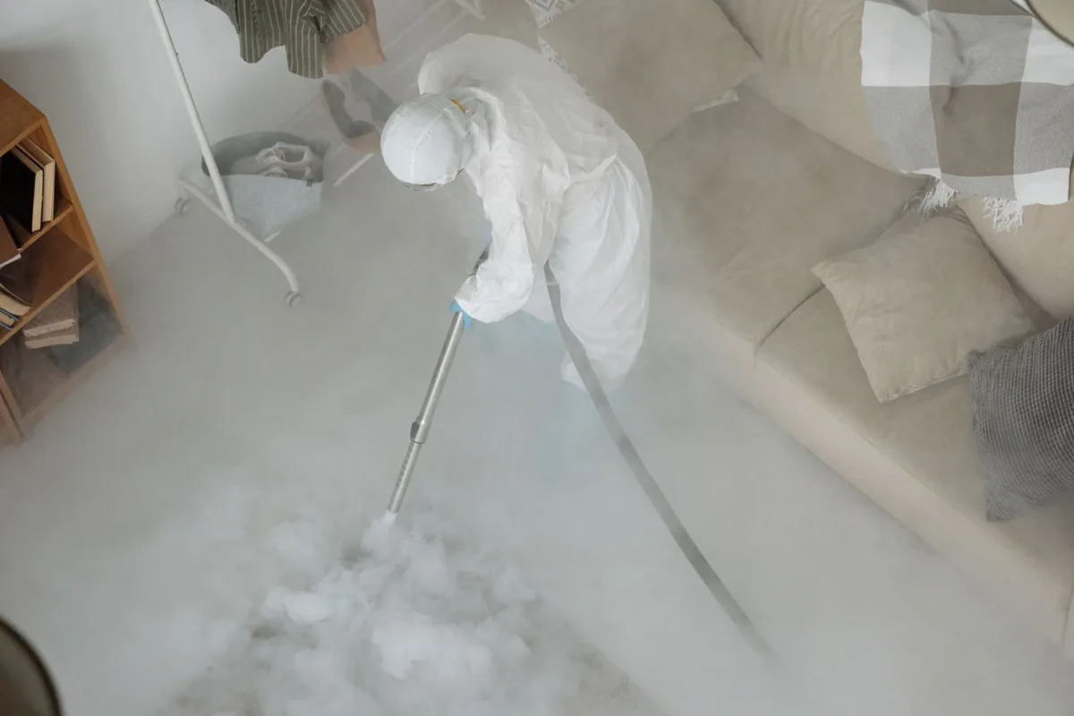 Biohazard cleanup technician in protective equipment, Coram, NY